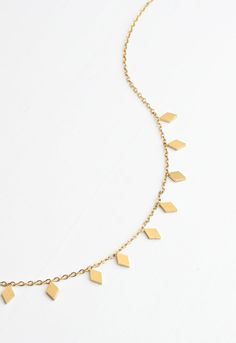 This shiny gold must-have necklace features a dainty chain adorned with chic 14K plated gold diamond-shaped pendants. Wear the All is Bright Necklace alone or layer it up for a touch of effortless shine to any outfit! Your purchase of the All is Bright Necklace to wear or to gift, gives survivors of human trafficking and exploitation the opportunity to build a bright sustainable life of freedom! Thank you! Box size and color may vary. Materials: 14k gold plated stainless steel necklace Hypoaller Elegant Starfish Necklace For Gift, Bohemian Starfish Necklace For Gifts, Yellow Gold Star Necklace With Birthstone, Elegant Gold Charm Necklace With Starfish, Elegant Yellow Gold Starfish Necklace, Bright Necklace, Joy Gifts, Timor Leste, Starfish