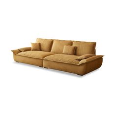 a tan couch with pillows on it