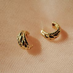 Our Maya Braided Hoops are the perfect everyday earring! What do we love about them? The textured gold hoops are dainty and the perfect size to accessorize every day. You can wear them alone for a minimalist look or stack them up with your other favorite earrings for a more edgy, eclectic style!EARRING FEATURES Gold Plated Brass Hoop (17mm) Titanium post Made for sensitive ears, nickel free Elegant Gold Small Hoop Ear Cuff, Elegant Huggie Hoop Earrings In Recycled Gold, Dainty Yellow Gold Ear Cuff For Everyday, Everyday Yellow Gold Plated Cartilage Earrings, Everyday Yellow Gold-plated Cartilage Earrings, 14k Yellow Gold Hoop Ear Cuff, Elegant Yellow Gold Hoop Ear Cuff, Elegant Recycled Gold Huggie Earrings, Gold Plated Hoop Ear Cuff Tarnish Resistant