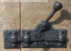 an old metal latch on a wooden door