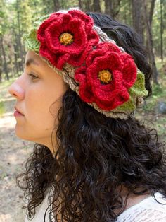 a woman wearing a crocheted flower headband