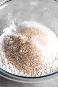 a bowl filled with dry ingredients on top of a table