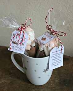 a cup filled with chocolate covered marshmallows