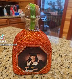 an orange bottle with a picture on it