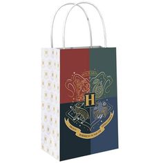 a harry potter paper bag with hogwart's crest on the front and sides