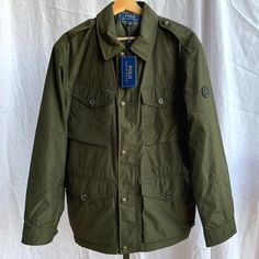 Polo Ralph Lauren Zip Down Combat Green Raincoat Jacket. Men's Size Medium. Brand New With Tags. Authentic Polo Ralph Lauren Item Will Be Packed Securely & Shipped Quickly. Please Let Me Know If You Have Any Questions! Olive Long Sleeve Outerwear With Flap Pockets, Olive Military Outerwear With Patch Pockets, Military Outerwear With Flap Pockets And Lapel Collar, Military Style Outerwear With Flap Pockets And Lapel Collar, Classic Green Utility Jacket For Outdoor, Classic Green Outerwear For Outdoor, Travel Outerwear With Flap Pockets In Khaki, Green Outerwear With Flap Pockets For Outdoor, Olive Outerwear With Multiple Pockets For Work