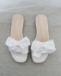 Classic slide flat sandals for casual and dressy look with added SATIN BOW. Simple and easy wear for brides, bridesmaids and wedding parties.DETAILS:UPPER: Synthetic upper and liningMATERIALS: Manmade outsoleHEEL HEIGHT: 0.4"Imported Materials Bridesmaids Sandals, Bridesmaid Sandals, Fancy Sandals, Pretty Sandals, Bridal Sandals, Bow Sandals, Girly Shoes, Slip On Sandals, Wedding Sandals