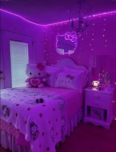 a hello kitty themed bedroom with pink lighting