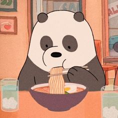 a panda eating noodles with chopsticks at a table