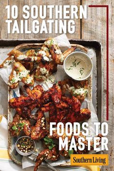 the cover of southern tailgating magazine features grilled chicken and dipping sauces on a tray