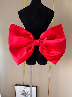 Friends, welcome to my shop. This bow is handmade with high-quality satin. All photos in this shop are taken by mobile phone, without any modification, and are taken in kind. For custom special colors or sizes, we will arrange production and delivery within 15 to 20 days. If you have urgent needs, please be sure to contact us. Custom styles and colors will not be refunded once confirmed. But if you have any quality or other problems, please feel free to contact us, we will try our best to solve Elegant Red Satin Bow, Elegant Red Party Sash, Elegant Red Sash For Party, Red Satin Bow For Party, Evening Satin Sashes With Bow, Satin Bow Tie With Ribbon For Party, Detachable Bow Satin Bow Tie For Party, Party Satin Bow Tie With Detachable Bow, Red Bow Dress