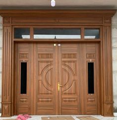 two wooden doors with decorative designs on them