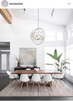 the instagram page shows an image of a dining room with white chairs and a wooden table