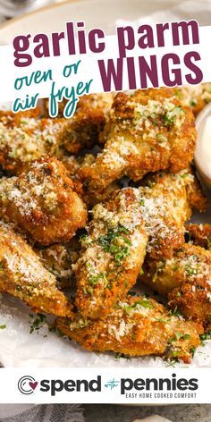 garlic parm wings on a plate with dipping sauce