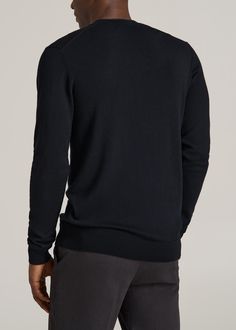 A Classic In Comfort Meet Your New Cold-Weather Companion Rediscover classic style with our Merino Wool Crewneck Tip Sweater. This tall men's sweater is a wardrobe essential, offering a sleek look with its ribbed collar, cuffs, and hem. The crewneck design of this tall men's merino wool sweater makes it an easy choice for any occasion, ensuring you look polished and stay warm.• Crafted from high-quality merino wool for lasting comfort• Ribbed details for a fit that's snug yet flexible• Long slee Black Fitted Sweater For Formal Occasions, Black Formal Winter Sweater, Classic Long Sleeve Sweater For Formal Occasions, Black Crew Neck Cardigan With Ribbed Collar, Classic Black V-neck Sweater, Formal Black Fine Knit Sweater, Black Long Sleeve Sweater For Formal Occasions, Black V-neck Sweater For Formal Occasions, Fitted Business Cardigan