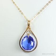 Elevate your style with this exquisite sapphire blue Austrian crystal pendant necklace, handcrafted by Jessica Luu Jewelry. The stunning pendant features a captivating Austrian crystal in a rich sapphire hue, suspended from an 18-inch 14K gold filled chain. This necklace is a true masterpiece, combining the brilliance of Austrian crystals with the elegance of 14K gold filled metal. Whether you're dressing up for a special occasion or adding a touch of glamour to your everyday look, this pendant necklace is sure to turn heads. Crafted with meticulous attention to detail, each piece is a testament to Jessica Luu Jewelry's commitment to quality and artistry. Elevate your jewelry collection with this timeless and versatile accessory that effortlessly transitions from day to night. ~ Handcrafte Sapphire Crystal Drop Jewelry, Sapphire Drop Beads For Jewelry Making, Blue Faceted Drop Jewelry, Blue Faceted Round Pendant Necklaces, Blue Faceted Crystal Necklace As Gift, Blue Faceted Crystal Necklace For Gift, Blue Faceted Round Pendant Necklace, Blue Faceted Crystal Necklace Gift, Sapphire Teardrop Crystal Necklace