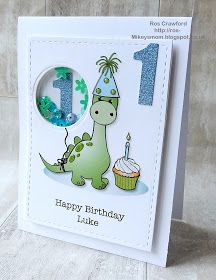 a birthday card with a dinosaur holding a cupcake and the number one on it