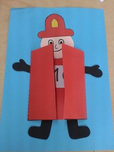 an origami fireman holding a red jacket