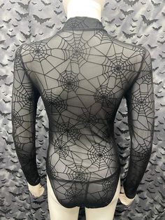 This is an Official Part 1 spiderweb pattern sheer long sleeve black bodysuit. This has The Part 1 image screen printed on the front. 95% nylon / 5% spandex These are handmade screenprinted and slightly vary from the photo. Please feel free to email me any questions. Thanks for looking. Due to an influx of incorrect addresses if a package is returned, you must pay the shipping cost to resend the item to you. I do not do exchanges and I do not take returns unless the item is damaged. I thoroughly Spider Web Costume Women Diy, Black Long Sleeve Sheer Bodysuit, Sheer Stretch Long Sleeve Bodysuit, Black Sheer Long Sleeve Bodysuit, Sheer Long Sleeve Stretch Bodysuit, Black Fitted Bodysuit With Sheer Sleeves, Fitted Black Bodysuit With Sheer Sleeves, Stretch Bodysuit With Sheer Long Sleeves, Gothic Bodysuit For Halloween Costume Party