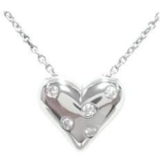 TIFFANY & Co. Etoile Platinum 5 Diamond Heart Pendant Necklace Metal: Platinum Weight: 12.0 grams Chain: 16" Pendant: 16mm wide Diamond: 5 round brilliant diamonds, carat total weight .15 Hallmark: "©TIFFANY&CO. PT950" on pendant and chain tag Condition: Excellent condition, comes with Tiffany box Authenticity Guaranteed Heart-shaped Diamond Necklace With Polished Finish, Heart-shaped Diamond Necklaces With Polished Finish, Diamond Heart Necklaces With Polished Finish, Valentine's Day Diamond Necklace With Polished Finish, Tiffany Box, Diamond Heart Pendant Necklace, Heart Pendant Diamond, Tiffany And Co, Metal Necklaces