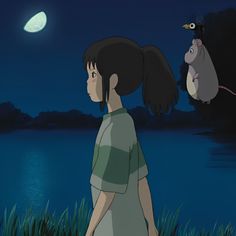 a girl looking at an animal flying in the sky above her and another person watching