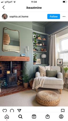 a living room filled with furniture and a fire place in front of a mirror on the wall