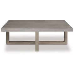 the concrete coffee table is shown with two legs and one end on it's base