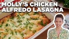 a woman standing next to a casserole dish with cheese and herbs on it