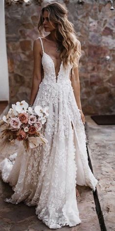 a woman in a wedding dress holding a bouquet