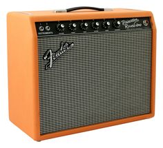 an orange amp guitar amplifier sitting on top of a white background