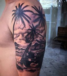 a man's half sleeve with an airplane and palm trees on the beach tattoo