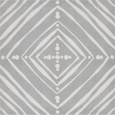 a gray and white rug with an abstract design