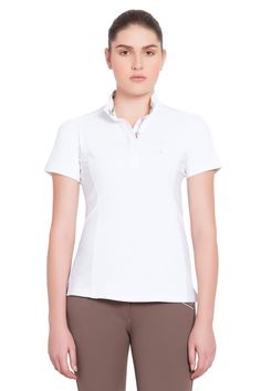 The Equine Couture Ladies Cara Short Sleeve Show Shirt is lightweight and great for summer showing in any discipline! Made from smooth micro polyester, the pull over style, with a hidden snap-up front, gives a polished show ring look, with a stock tie loop when needed. Cooling features include EquiCool technology for moisture wicking and UV protection. The stretch side panel ensures a great fit with additional breathability. Esthetic details include contrast stitching, a striped ribbon inside of Tailored Sportsman, Stock Tie, Striped Ribbon, Equestrian Outfits, Couture Collection, Collar And Cuff, Uv Protection, Shirt Shop, Moisture Wicking