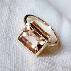 **KINDLY CHECK OUT THE VIDEO OF THE ITEM FOR A CLEARER VIEW**Details of the ring Gem: Morganite Gem size & shape: 8x10, octagan Gem weight: 3.25 carats Gold purity: 14K (58.33% approx.) Gold weight: 2.60 grams total weight of ring: 3.25 grams Fine natural Morganite gemstone ring set in solid 14K Yellow gold. The ring has a fine jewelry, which looks absolutely chic and beautiful on the finger. The Gold purity is guaranteed and it comes with authentic 14 kt gold hallmark. Since these Rings are 14k Gold Square Cut Emerald Ring, 14k Gold Emerald Ring Square Cut, 14k Gold Jewelry With Bezel Set Rectangular Stone, Heirloom Morganite Jewelry In Yellow Gold, 14k Gold Rectangular Solitaire Jewelry, 14k Gold Solitaire Square Cut Jewelry, 14k Gold Solitaire Jewelry With Rectangular Shape, 14k Gold Ring With Square Cut And Prong Setting, 14k Gold Rings With Square Cut Prong Setting