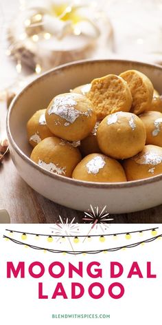 moong dal ladoo in a bowl with the words moong dal ladoo on it