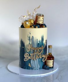 a birthday cake decorated with liquor and confections