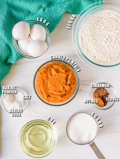 ingredients to make pumpkin pie laid out on a white table with green towel and blue towel