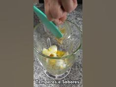 someone is mixing ingredients in a glass bowl