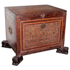 an ornate wooden box with carvings on the front and sides, inlaided with flowers