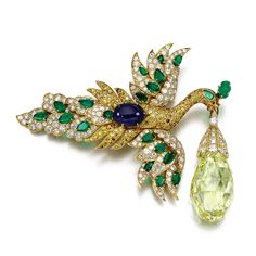 IWhite diamonds, emeralds and a cabochon sapphire in yellow gold bird brooch with "Walska Briolette Diamond" suspended. Once owned by opera singer Ganna Walska, the fancy vivid yellow 96.62ct briolette diamond was bought by Van Cleef & Arpels in 1971. The Walska can be removed & worn as a pendant, the wings can be detached to form a pair of earrings & the tail transforms into a brooch. Briolette Diamond, Van Cleef & Arpels, 13 November, Van Cleef And Arpels, Jewelry Auction, Diamond Brooch, Bird Brooch, Bird Jewelry, Pink Stars