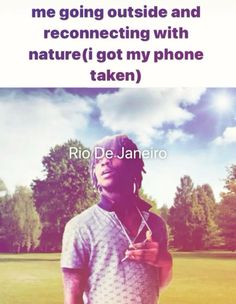 a man standing in front of a field with trees