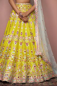 Greenish mustard lehenga with resham-foil work, gota-mirror embroidery and multi-color motifs. Comes with blouse and organza blue dupatta.
Component: 3
Embroidered
Neckline: Sweetheart
Sleeve Length: Sleeveless
Fabric: Chanderi, Organza; Lining: Crepe
Color: Yellow, Green
Plunging neck
Cutwork detail - Aza Fashions Yellow Semi-stitched Gown With Intricate Embroidery, Semi-stitched Yellow Gown With Intricate Embroidery, Yellow Anarkali Set With Intricate Embroidery In Dola Silk, Yellow Dola Silk Anarkali Set With Intricate Embroidery, Yellow Bollywood Gown With Traditional Drape, Yellow Gown With Intricate Embroidery For Festive Occasions, Festive Yellow Gown With Intricate Embroidery, Mustard Zari Work Sets For Wedding, Yellow Zari Work Gown For Navratri