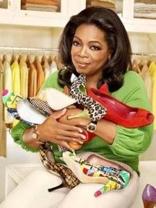 a woman sitting on top of a white chair holding a stuffed animal in her arms