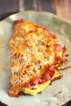 a slice of pizza sitting on top of a pan covered in cheese and toppings