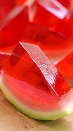 slices of watermelon sit on a cutting board