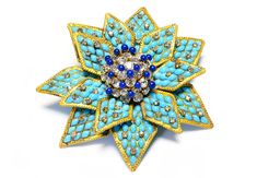 Rare Coco Chanel Paris BroochThis 1930's Coco Chanel brooch features a stunning Gripoix blue turquoise glass camellia flower. Handcrafted by artisans in Paris, this brooch exudes elegance and adds a touch of vintage charm to any outfit. The vibrant colors and intricate design make it a timeless statement piece. Diameter 3.5". Made in France. CHANEL JEWELRY Chanel Brooch Outfit, Luxury Turquoise Brooches For Gift, Luxury Cameo Brooch, Luxury Flower Shaped Brooch Jewelry, Blue Floral Brooch Jewelry, Luxury Retro Collectible Brooches, Chanel Camellia Brooch, Luxury Vintage Gemstone Brooches, Chanel Brooch