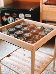 a wooden table topped with lots of coffee cups