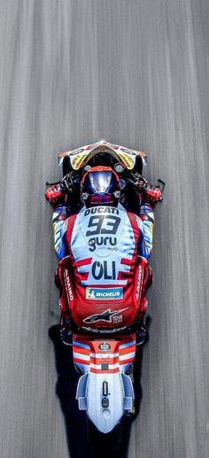 a person riding a motorcycle on a race track