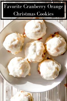 a white plate topped with cookies covered in frosting