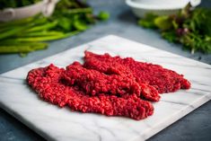 raw ground beef on a marble cutting board